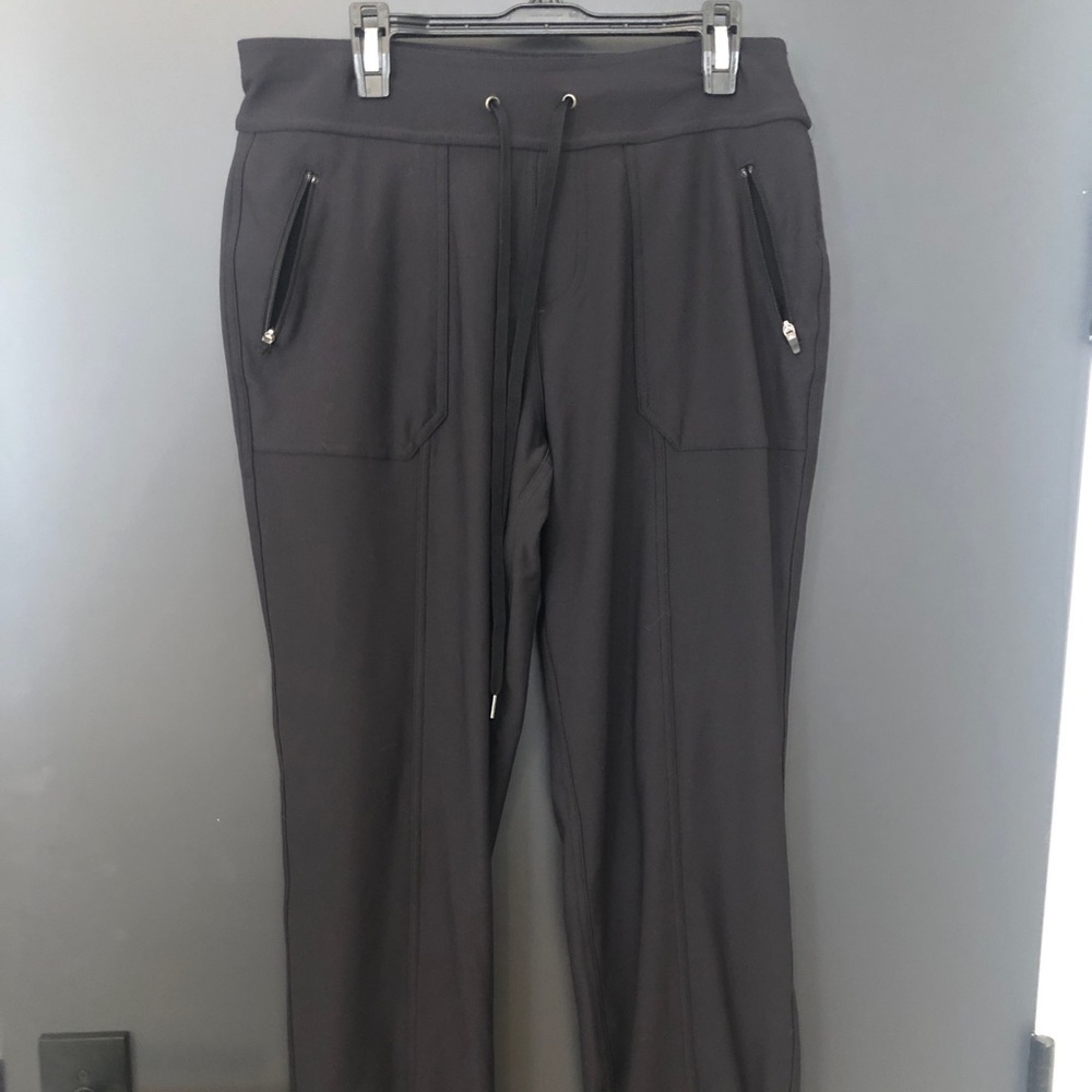 Black tek gear joggers with zipper pockets.